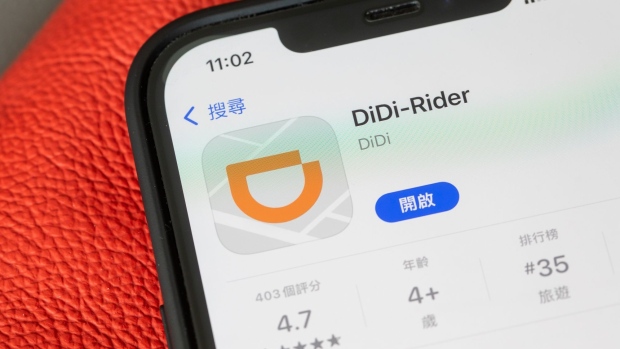 The Didi Global Inc. app for download on the Apple Inc. App Store on a smartphone arranged in Hong Kong, China, on Friday, Dec. 3, 2021. Didi has begun preparations to withdraw from U.S. stock exchanges and will start work on a Hong Kong share sale, a stunning reversal as it yields to demands from Chinese regulators that had opposed its American listing. Photographer: Paul Yeung/Bloomberg