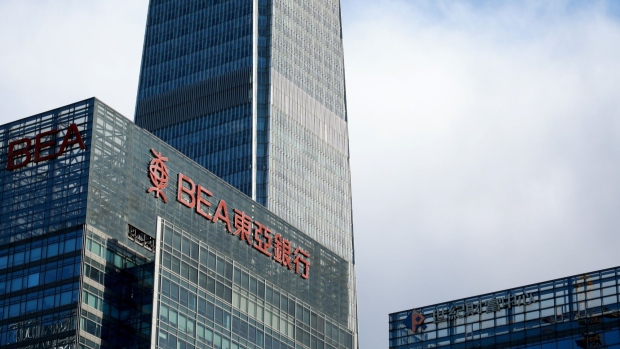 The Bank of East Asia (BEA) Ltd. building, left to right, China World Trade Center Tower III, and the Ping An Insurance Group Co. building stand in the central business district of Beijing, China, on Thursday, March 14, 2019. China is planning to approve new rules for foreign investment in the country this week, a sweeping overhaul of regulations that will affect corporate titans from Ford to Alibaba and Tencent. Photographer: Giulia Marchi/Bloomberg