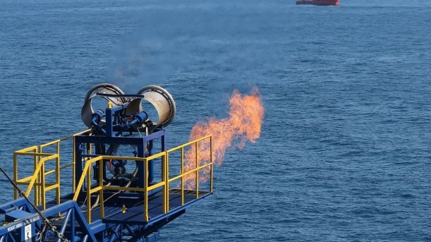 A flare is seen as gas from methane hydrate was produced from drilling in the Nankai Trough about 50 kilometers (31 miles) off the coast of Honshu island, Japan, in this handout photograph released to the media on March 12, 2013.