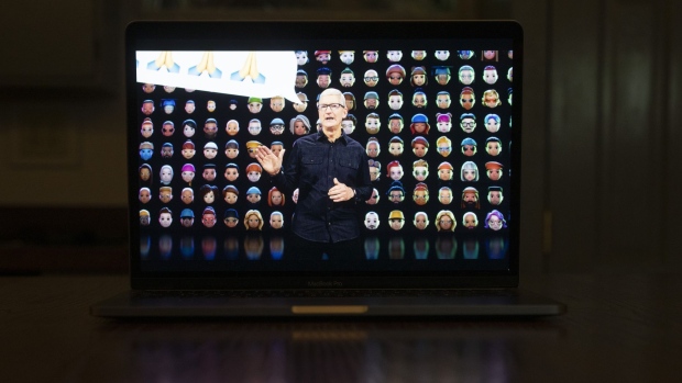 Tim Cook, chief executive officer of Apple Inc., speaks virtually during the Apple Worldwide Developers Conference on a laptop computer in Tiskilwa, Illinois, U.S., on Monday, June 7, 2021. Apple is expected to announce its long-rumored 14-inch and 16-inch MacBook Pro with Apple silicon at WWDC, according to Wedbush analyst Daniel Ives.