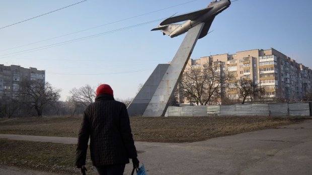 BERDYANSK, UKRAINE - FEBRUARY 16: A local resident walks near a Soviet monument on February 16, 2022 in Berdyansk, Ukraine. Russian forces are conducting large-scale military exercises in Belarus, across Ukraine's northern border, amid a tense diplomatic standoff between Russia and Ukraine's Western allies. Ukraine has warned that it is virtually encircled, with Russian troops massed on its northern, eastern and southern borders. The United States and other NATO countries have issued urgent alerts about a potential Russian invasion, hoping to deter Vladimir Putin by exposing his plans, while trying to negotiate a diplomatic solution. (Photo by Pierre Crom/Getty Images) Photographer: Pierre Crom/Getty Images Europe