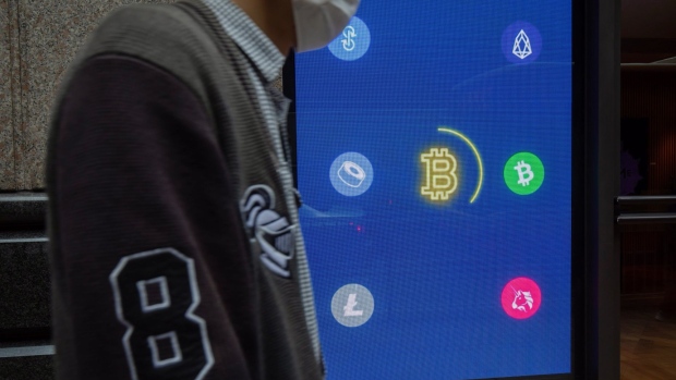 A digital screen displays logos of various cryptocurrencies in Hong Kong, China, on Thursday, Feb. 10, 2022. Employees all over the world are opting to get paid in cryptocurrencies, though they're still in a small minority, according to global payrolls and hiring company Deel. Photographer: Paul Yeung/Bloomberg