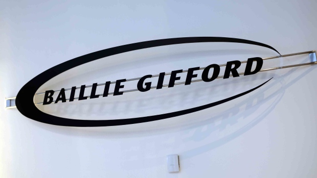 The Baillie Gifford & Co. logo hangs on the wall in the reception area of the company's offices in Edinburgh, U.K., on Tuesday, Feb. 7, 2017. In the past decade, Baillie Gifford has emerged as one of the world's most active technology investors, and one of a tiny number of European investment houses that matter in Silicon Valley and Shenzhen. Photographer: Chris Ratcliffe/Bloomberg
