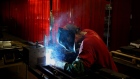 A worker welds a lawnmower frame at a factory in Coatesville, Indiana. Photographer: Luke Sharrett/Bloomberg