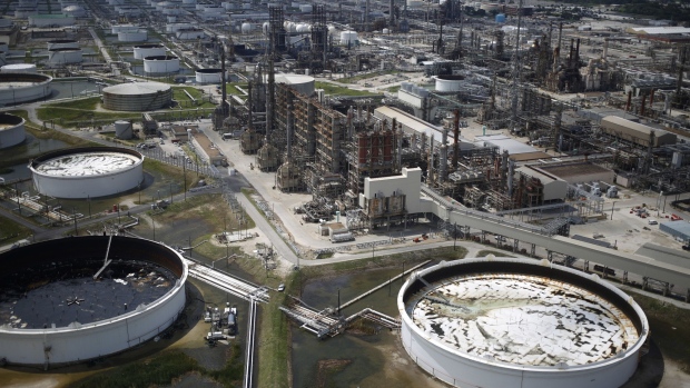 Oil refinery storage tanks and petrochemical refineries stand in this aerial photograph taken above Texas City, Texas.
