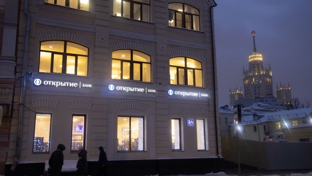 An Otkritie Bank FC PJSC branch at night in Moscow, Russia, on Tuesday, Jan. 18, 2022. UniCredit SpA is interested in a potential takeover of rescued Russian lender Otkritie Bank, as Chief Executive Officer Andrea Orcel explores M&A opportunities to improve the group’s profitability.