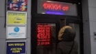 A digital sign displays exchange rates at the door of a currency exchange bureau in Moscow, Russia, on Thursday, Feb. 24, 2022. Russian forces attacked targets across Ukraine after President Vladimir Putin ordered an operation to “demilitarize” the country, prompting international condemnation and threats of further punishing sanctions on Moscow, sending markets tumbling worldwide. Photographer: Andrey Rudakov/Bloomberg