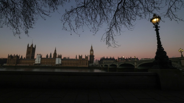 The Houses of Parliament on the bank of the River Thames in London. Photographer: Chris Ratcliffe/Bloomberg