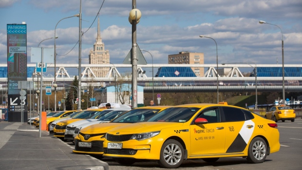 Automobiles operated by Yandex.Taxi service sit parked in the Moscow International Business Center (MIBC), also known as Moscow City, in Moscow, Russia, on Tuesday, April 28, 2020. Russia has reported 93,558 confirmed Covid-19 cases.