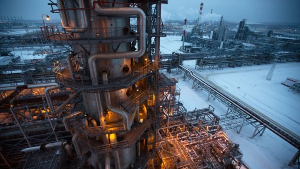 Electrical light illuminates a petroleum cracking tower at the Lukoil-Nizhegorodnefteorgsintez oil refinery, operated by OAO Lukoil, in Nizhny Novgorod, Russia.