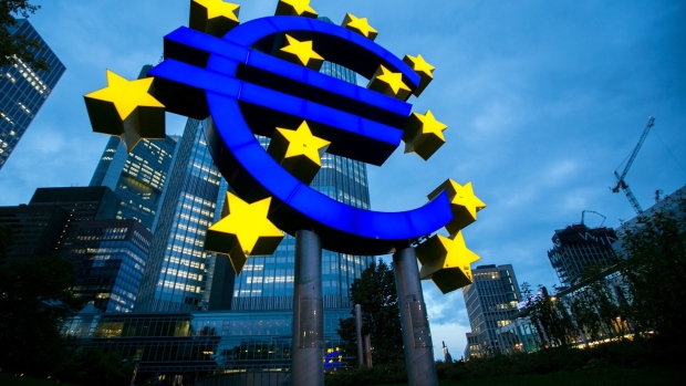 FILE: The euro sign sculpture stands illuminated outside the former European Central Bank (ECB) headquarters at dusk in Frankfurt, Germany, on Thursday, Oct. 20, 2016. U.K. Prime Minister Theresa May will put her Brexit deal to Parliament for a decisive vote on Dec. 11, but after her plan was savaged from all sides, the signs are shes on course to lose. The vote will mark the moment when British politicians decide whether to accept the contentious divorce terms May has struck with the European Union -- or put the country on course to crash out of the bloc with no agreement in place. Our editors look back at some of the key photographs that capture the Brexit journey. Photographer: Bloomberg/Bloomberg