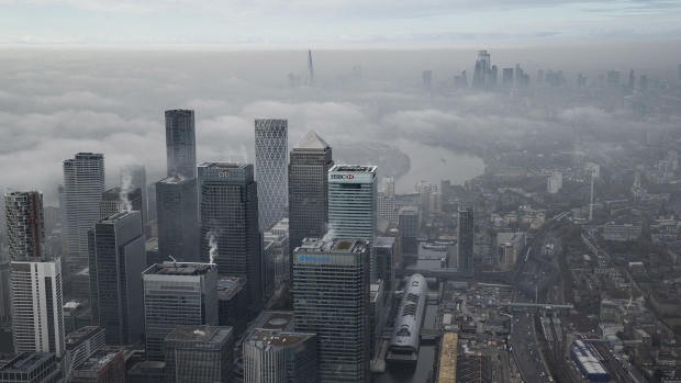 LONDON, ENGLAND - NOVEMBER 05: Fog shrouds the Canary Wharf business district including global financial institutions Citigroup Inc., State Street Corp., Barclays Plc, HSBC Holdings Plc and the commercial office block No. 1 Canada Square, on the Isle of Dogs on the first day of the new national lockdown for England, on November 05, 2020 in London, England. England today began a second national lockdown to curb a surge in covid-19 cases, closing pubs, restaurants and an array of shops deemed non-essential. The new rules, which will expire on 2 December, also bans most indoor and outdoor household mixing and grass-roots sports. Unlike the first lockdown earlier this year, schools in England will remain open. (Photo by Dan Kitwood/Getty Images)