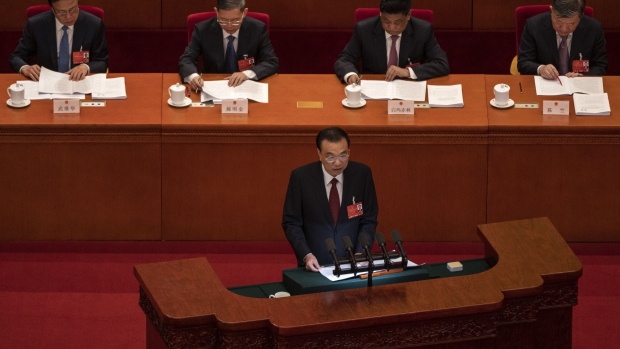 BEIJING, CHINA - MARCH 05: Chinese Premier Li Keqiang speaks from the podium at the opening session of the National Peoples Congress at the Great Hall of the People on March 5, 2022 in Beijing, China. China"u2019s annual political gathering known as the Two Sessions opened Friday and will convene leaders and lawmakers to set the government"u2019s agenda for domestic economic and social development for the year. (Photo by Kevin Frayer/Getty Images) Photographer: Kevin Frayer/Getty Images AsiaPac