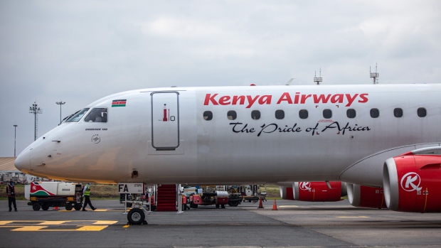 An Embraer SA 190 passenger aircraft, operated by Kenya Airways Ltd., stands on the tarmac during a reopening ceremony at Jomo Kenyatta International Airport in Nairobi, Kenya, on Wednesday, July 15, 2020. Kenya Airways Plc started a three-month round of job cuts as lawmakers debate a bill to nationalize the carrier and its losses mount due to the impact of the coronavirus pandemic.