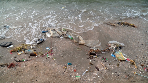 Trash sits along the shore at Bangsaen beach in Chon Buri, Thailand, on Sunday, Jan. 19, 2020. Thailand's love of plastic bags helped make it the sixth-worst maritime polluter. The country generates more than 5,000 metric tons of plastic trash a day, three-quarters of which ends up in landfills. Photographer: Nicolas Axelrod/Bloomberg