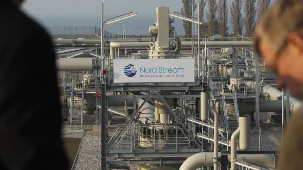 Visitors look out at the central facility where the Nord Stream Baltic Sea gas pipeline reaches western Europe following the pipeline's official inauguration in Lubmin, Germany in 2011. 