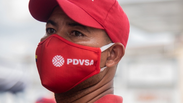 CARACAS, VENEZUELA - JUNE 01: A PDVSA worker wears a protective mask with the logo of the company on June 1, 2020 in Caracas, Venezuela. After 77 days, Maduro Administration eases the restrictions against COVID-19, allowing certain activities to reopen. From today, an official limit has been set for individuals who want to buy fuel at a subsidized price: 120 liters for cars and60 for motorbikes. Beyond that, drivers will be required to pay international prices (0.5 USD per liter) in 200 designated gas stations. This decision comes days after the arrival of Iranian fuel tankers with gasoline. (Photo by Carolina Cabral/Getty Images) Photographer: Carolina Cabral/Getty Images South America