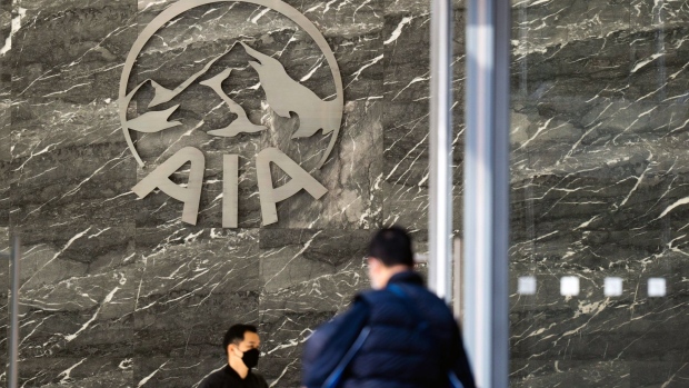 Signage for AIA Group Ltd. at the AIA Kowloon Tower building in Hong Kong, China, on Wednesday, March 9, 2022. AIA is scheduled to release earnings results on March 11. Photographer: Bertha Wang/Bloomberg