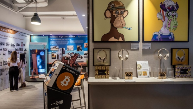 The physical artwork of "Bored Ape #2967" created by Bored Ape Yacht Club, left, and "Mutant Ape #1933" created by Mutant Ape Yacht Club, both available for sale as an NFT, displayed at a CoinUnited cryptocurrency exchange in Hong Kong, China, on Friday, March 4, 2022. Bitcoin fell below $38,000 on March 8, touching its lowest price in a week, as global markets tumbled on concerns that spiraling commodities prices unleashed by Russia's invasion of Ukraine may have a wider and longer-lasting impact than previously thought. Photographer: Paul Yeung/Bloomberg
