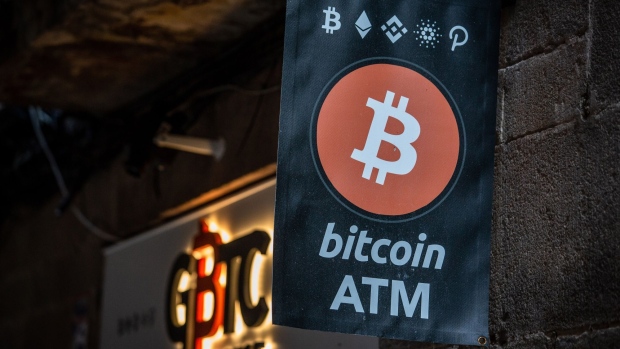 A Bitcoin automated teller machine (ATM) sign outside a cryptocurrency exchange in Barcelona, Spain, on Wednesday, March 9, 2022. Bitcoin dropped back below $40,000, erasing almost all the gains sparked by optimism about U.S. President Joe Biden’s executive order to put more focus on the crypto sector.