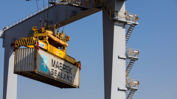 A crane carries a shipping container, owned by AP Moller-Maersk A/S, at London Gateway port, operated by DP World Plc, in Stanford-le-Hope, U.K., on Tuesday, Sept. 22, 2020. France said the European Union should keep pursuing a free-trade agreement with the U.K. while warning that any British violation of the Brexit agreement would end the push.