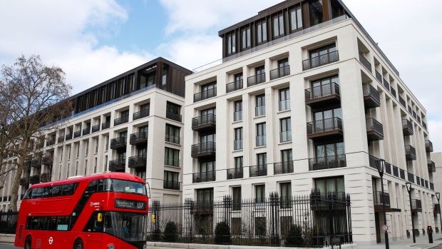 A London bus passes Chelsea Barracks residential development in London, U.K., on Sunday, March 7, 2021. Sales of luxury properties tumbled 13% as the pandemic spurred the richest buyers to look to the countryside.