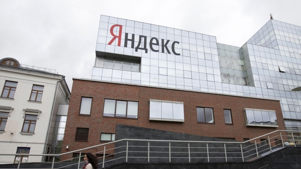 A pedestrian passes the headquarters of Yandex NV in Moscow.