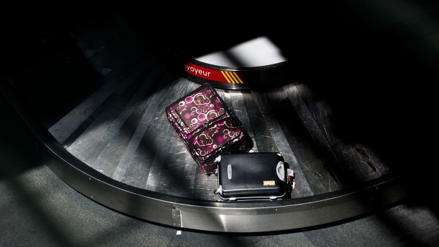 Luggage moves on a baggage carousel at Toronto Pearson International Airport in Toronto, Ontario, Canada.