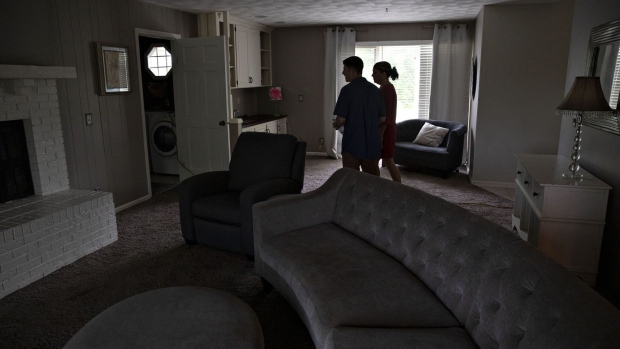 A real estate agent shows a prospective home buyer a house for sale in Peoria, Illinois, U.S., on Thursday, May 30, 2019. The National Association of Realtors is scheduled to release existing homes sales figures on June 21.