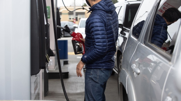 A customer refuels a vehicle at a Costco gas station in Federal Way, Washington, U.S, on Thursday, March 10, 2022. Crude surged to the highest in almost 14 years this week after the U.S. and the U.K. said they will ban Russian oil imports as President Vladimir Putin continues with his invasion of Ukraine. Photographer: Chona Kasinger/Bloomberg