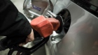 A customer pumps fuel. Photographer: Soichiro Koriyama/Bloomberg