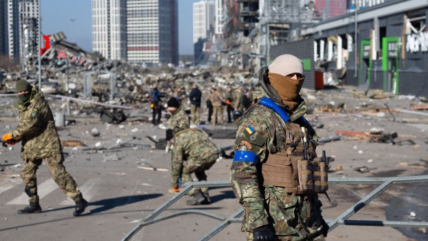 KYIV, UKRAINE - MARCH 21: Ukrainian servicemen are seen at the explosion site as a result of a rocket strike into the shopping mall on March 21, 2022 in Kyiv, Ukraine. As Russia's advance on Kyiv has largely stalled, the Ukrainian capital has continued to be hit by missiles and shellfire. More than three million people have fled Ukraine since Russia launched its large-scale invasion of the country on Feb. 24. (Photo by Anastasia Vlasova/Getty Images)