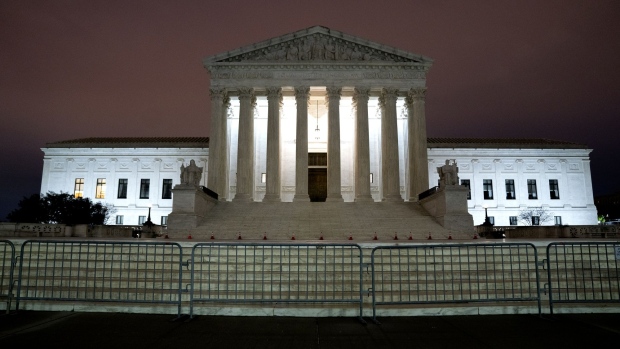 Police barricades in front of the U.S. Supreme Court building in Washington, D.C., U.S., on Friday, April 9, 2021. U.S. President Joe Biden on Friday issued an executive order establishing a panel to study possible changes to the U.S. Supreme Court, including calls for term limits and more justices.