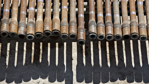 Drill pipe sits on a rack near a Nabors Industries Ltd. rig drilling for Chevron Corp. in the Permian Basin near Midland, Texas, U.S., on Thursday, March 1, 2018. Chevron, the world's third-largest publicly traded oil producer, is spending $3.3 billion this year in the Permian and an additional $1 billion in other shale basins. Its expansion will further bolster U.S. oil output, which already exceeds 10 million barrels a day, surpassing the record set in 1970. Photographer: Daniel Acker/Bloomberg