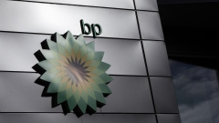 The BP Plc company logo at the entrance to the BP Pulse headquarters in Milton Keynes, U.K., on Tuesday, Feb. 9, 2021. BP aims to cut its oil and gas production by 40%, increase low-carbon spending to $5 billion a year and produce 50 gigawatts of renewable energy by the end of the decade. Photographer: Chris Ratcliffe/Bloomberg