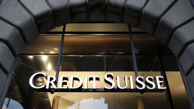 A Credit Suisse logo hangs in the entrance to a Credit Suisse Group AG bank branch in Zurich.