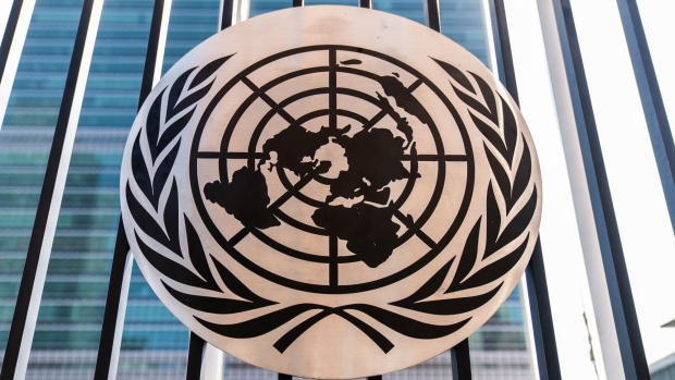 A fence displays the United Nations (UN) logo outside its headquarters in New York, U.S., on Tuesday, Sept. 22. 2020. The United Nations General Assembly met in a virtual environment for the first time in its 75-year history due to the pandemic. Photographer: Jeenah Moon/Bloomberg