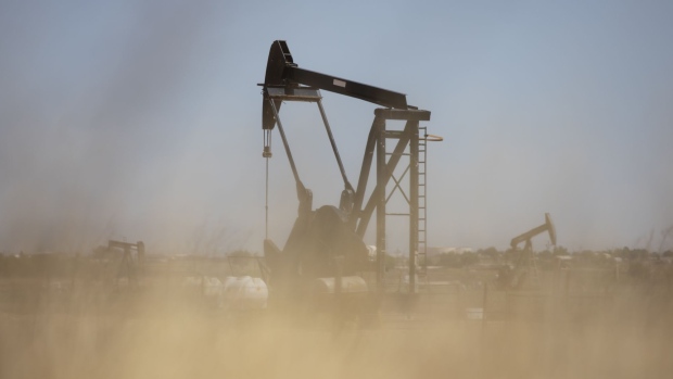 Active pump jacks stand in Midland, Texas, U.S, on Thursday, April 23, 2020. The price for the U.S. benchmark for crude oil, West Texas Intermediate, dropped below zero for the first time in history this month amid a global oil glut. Photographer: Matthew Busch/Bloomberg