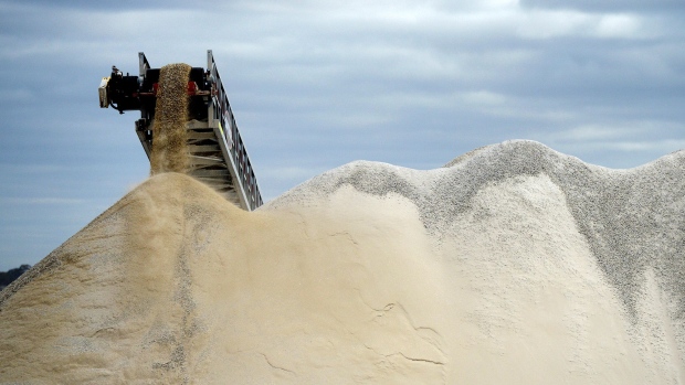 Lithium ore falls from a chute onto a stockpile at the Bald Hill lithium mine site, co-owned by Tawana Resources Ltd. and Alliance Mineral Assets Ltd., outside of Widgiemooltha, Australia.