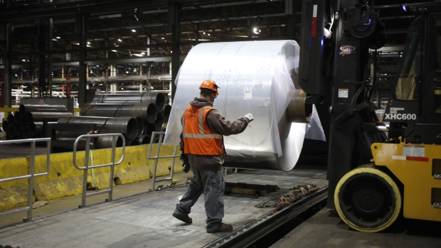 A worker loads an aluminum coil onto a truck at the Arconic manufacturing facility in Alcoa, Tennessee, U.S., on Wednesday, March 9, 2022. Metals including aluminum and copper have soared to record highs following Russia's invasion on fears of disruptions to trade flows. Photographer: Luke Sharrett/Bloomberg