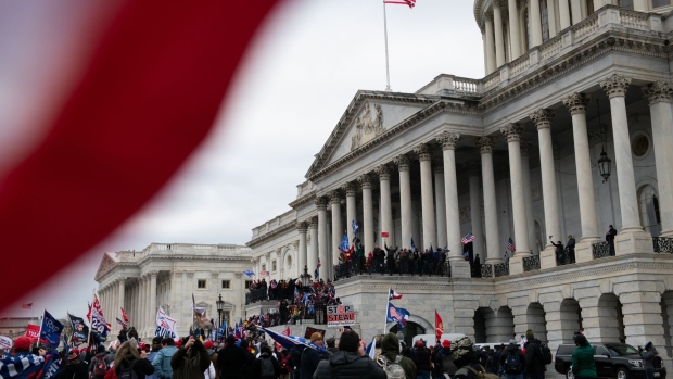 Demonstrators enter the U.S. Capitol after breaching security fencing during a protest in Washington, D.C., U.S., on Wednesday, Jan. 6, 2021. The House and Senate will meet in a joint session today to count the Electoral College votes to confirm President-elect Joe Biden's victory, but not before a sizable group of Republican lawmakers object to the counting of several states' electors. Photographer: Graeme Sloan/Bloomberg