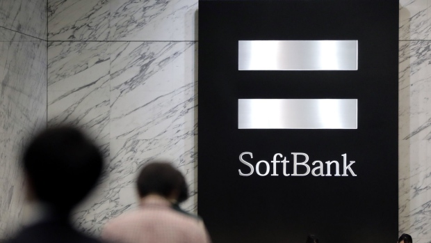 The SoftBank Group Corp. logo is displayed inside the lobby of a building which houses the company's headquarters in Tokyo, Japan, on Thursday, Nov. 29, 2018. SoftBank's 2.4 trillion yen ($21 billion) initial public offering of its Japanese telecommunications unit has successfully secured sales for the bulk of its shares to individual investors, people familiar with the matter said. Photographer: Kiyoshi Ota/Bloomberg