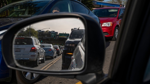 Traffic on Richards Blvd. in Sacramento, California, U.S., on Thursday, March 24, 2022. California Governor Gavin Newsom is proposing to send car owners $400 debit cards and partially pause gasoline taxes to address high gas prices. Photographer: David Paul Morris/Bloomberg