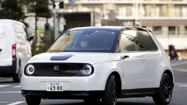 A Honda Motor Co. e electric vehicle during a test drive in Tokyo, Japan, on Thursday, June 17, 2021. Honda has become the first of Japan’s automakers to state publicly it will phase out sales of gasoline-powered cars completely, setting 2040 as the goal and giving newly minted Chief Executive Officer Toshihiro Mibe a once-in-a-career chance to put his stamp on a firm that can trace its lineage back 84 years.