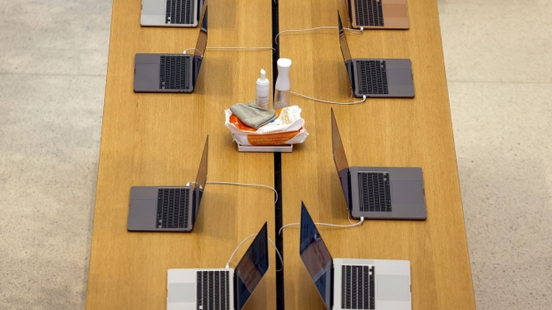 A table display of MacBook laptop computers in the Apple Inc. store on Regent Street in London, U.K., on Friday, Sept. 24, 2021. Apple is releasing its iPhone 13 lineup on Friday, testing whether new camera technology and aggressive carrier deals will get shoppers to snap up a modest update of last year's model.