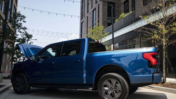 The Ford F-150 Lightning electric pickup will be a show-stopper this year at the auto show. This year, Ford's chief executive officer boosted the company's bet on plug-in models by more than a third, to $30 billion. Photographer: Al Drago/Bloomberg