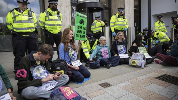 Extinction Rebellion activists outside the Shell Building on April 13, 2022 in London, 