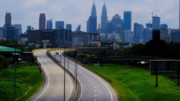 The city skyline beyond a deserted Sungai Besi Expressway in Kuala Lumpur, Malaysia, on Tuesday, June 1, 2021. Malaysia unveiled a 40 billion ringgit ($9.7 billion) package to help people and companies through the two-week nationwide lockdown that began today. Photographer: Samsul Said/Bloomberg