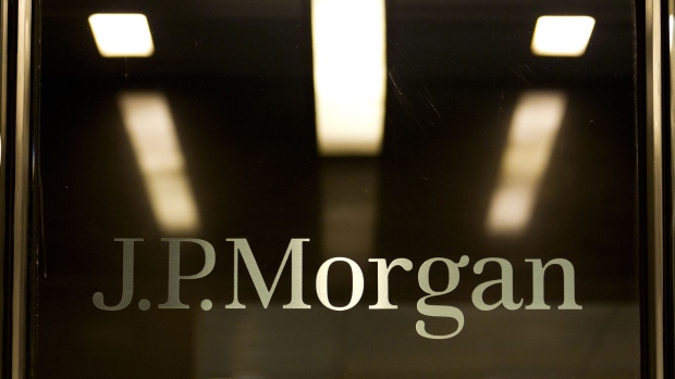 JPMorgan Chase & Co. signage is displayed at the entrance to their headquarters building in New York. State attorneys general have until Feb. 3 to decide whether to sign a proposed nationwide settlement of foreclosure wrongdoing with banks including JPMorgan Chase & Co. and Citigroup Inc. that may total as much as $25 billion.