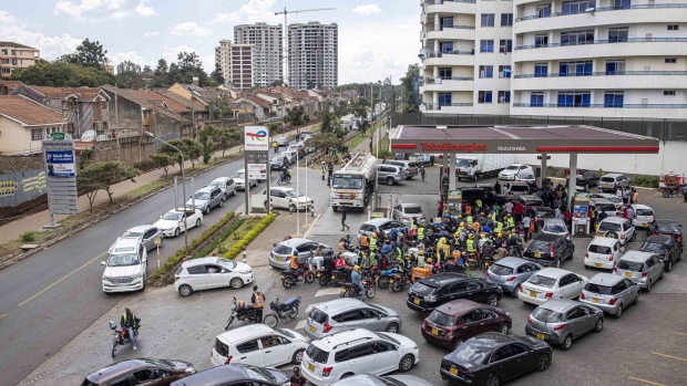 Drivers and motorcyclists queue for fuel at a Total Energies SE gas station in Nairobi, Kenya, on Wednesday, April 13, 2022. Kenya agreed to compensate oil marketers for selling fuel they imported at rates higher than what’s reflected in the retail cap, a bid to end a supply shortage in the country.